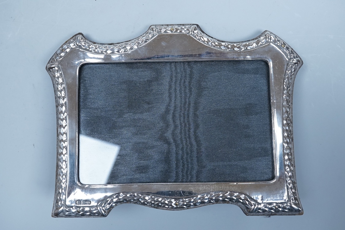 An Elizabeth II silver baluster christening mug, Wakely & Wheeler, London, 1965, with engraved inscription to the base, 10cm, together with two modern silver mounted photograph frames including a double and one other met